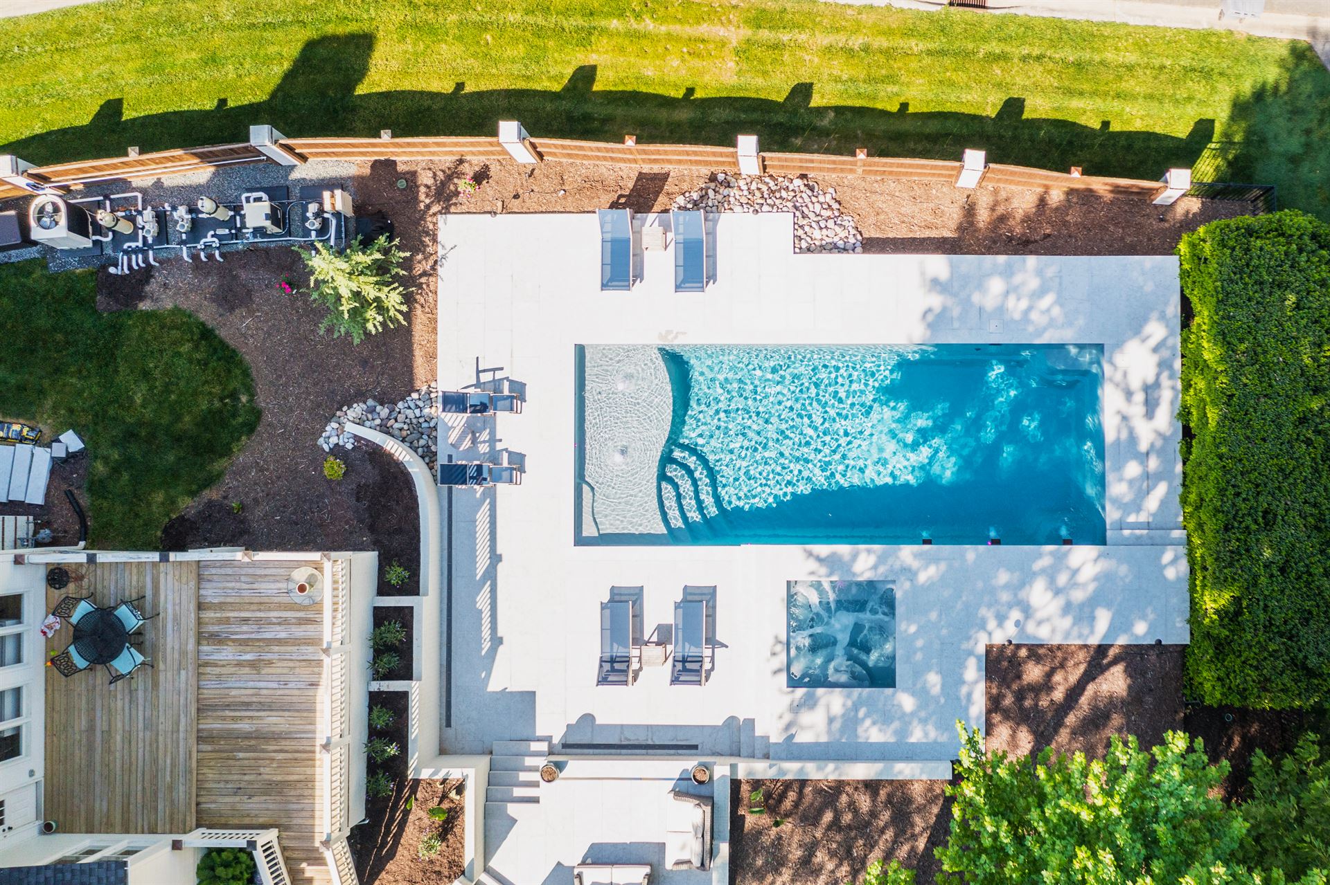 001. River Pools D40 + SS08 in Granite Gray with cascades, bubblers, and natural stone patio and coping-3