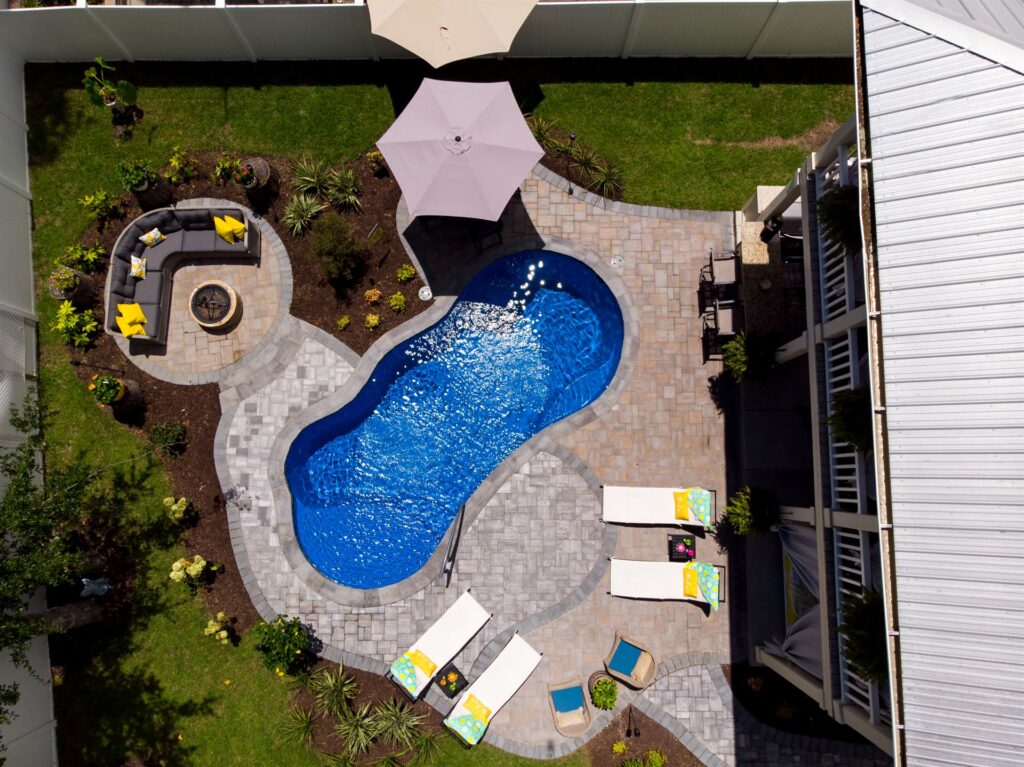 001. River Pools I25 in Maya Shimmer with concrete paver patio and coping