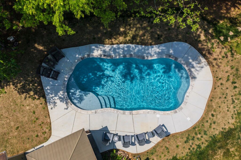 004. River Pools C35 in Granite Gray with brushed concrete and natural stone coping-2