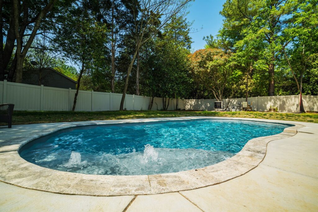 006. River Pools C35 in Granite Gray with bubbler, brushed concrete and natural stone coping