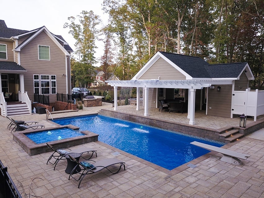 009. T40 pool with diving board, tanning ledge with bubblers and a spillway, and waterfall