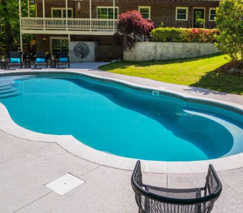 river-pools-c40-in-granite-gray-with-brushed-concrete-and-natural-stone-fiberglass-pool-installers